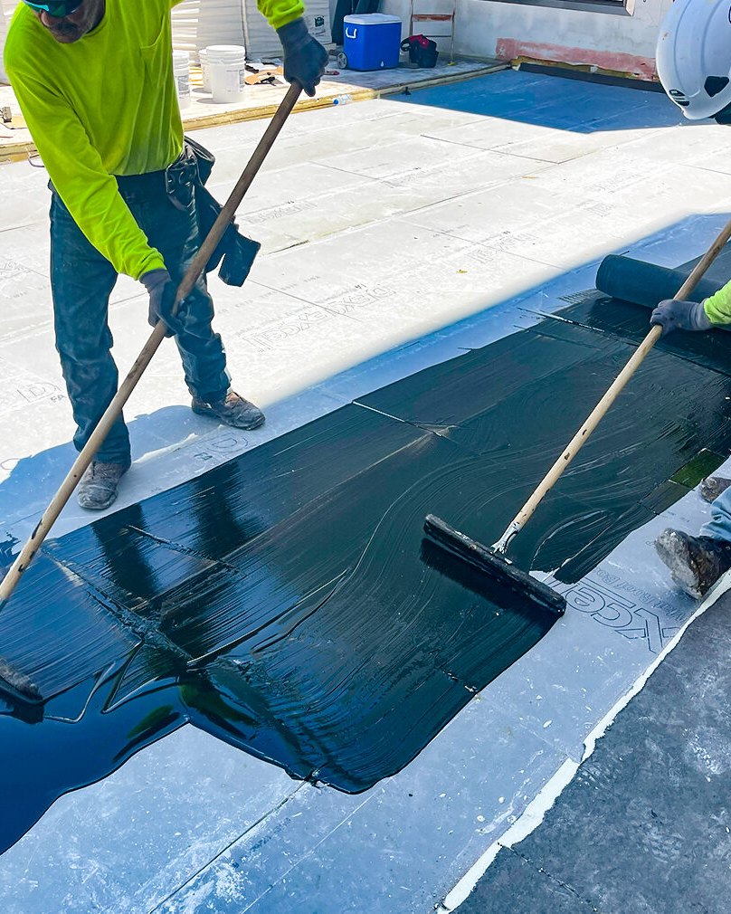 Crew installing a new membrane roof